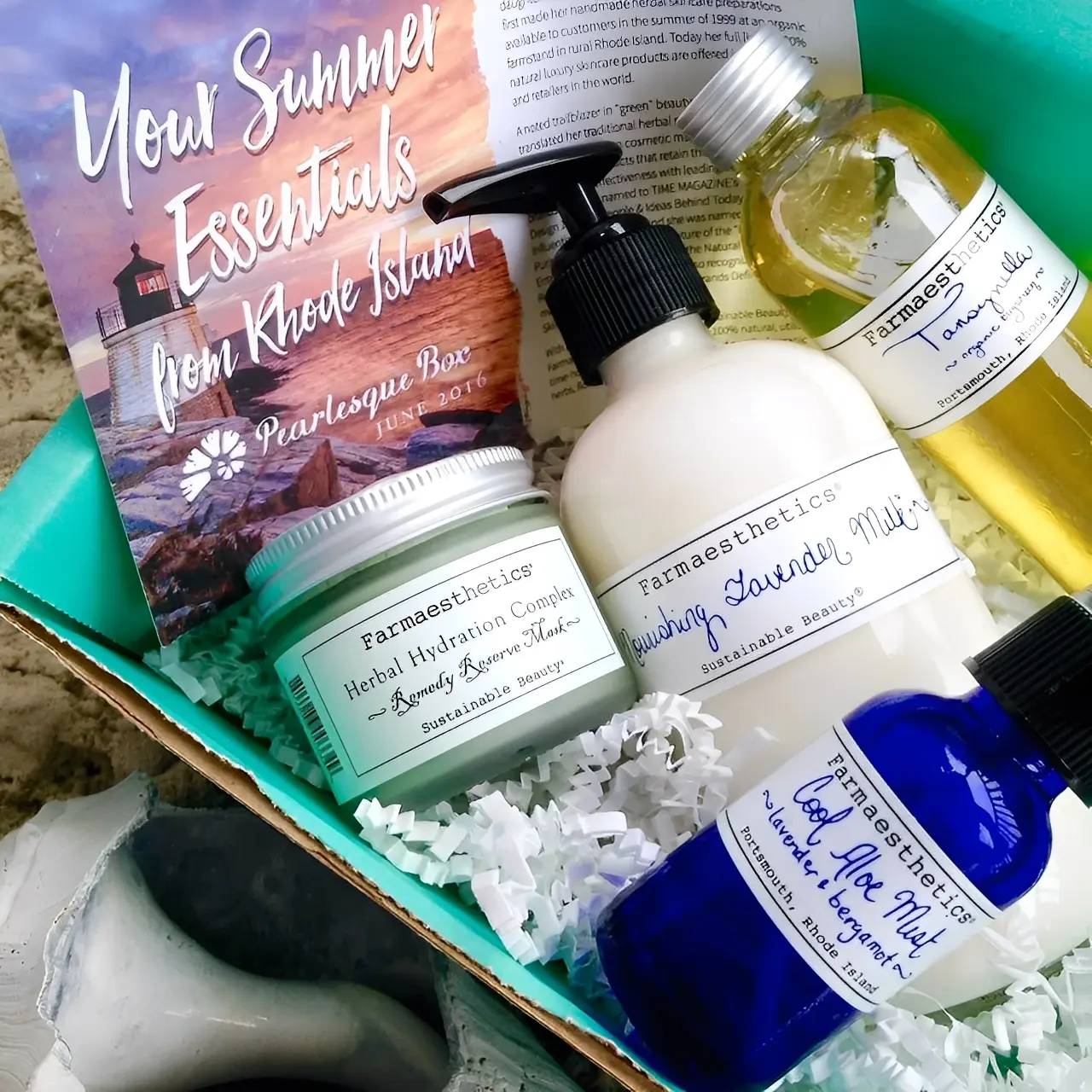 Skincare products in a summer essentials box.