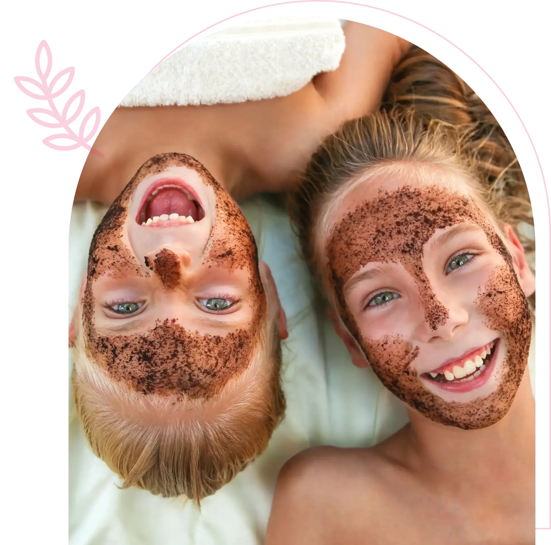 Children smiling with facial masks applied.