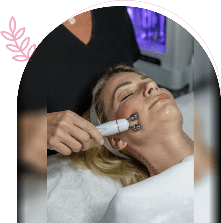 Woman receiving microcurrent facial treatment