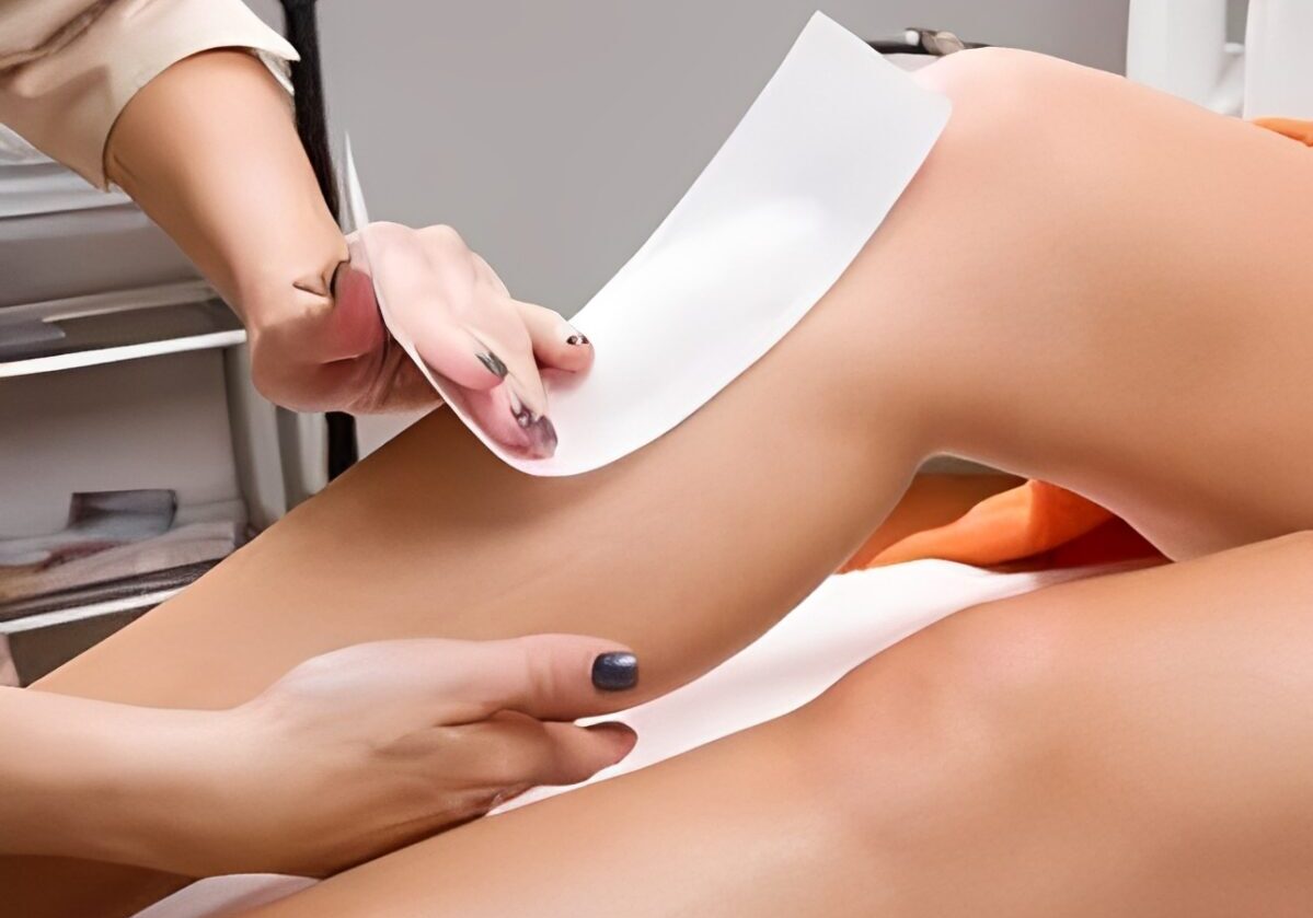 Leg waxing procedure in a beauty salon.