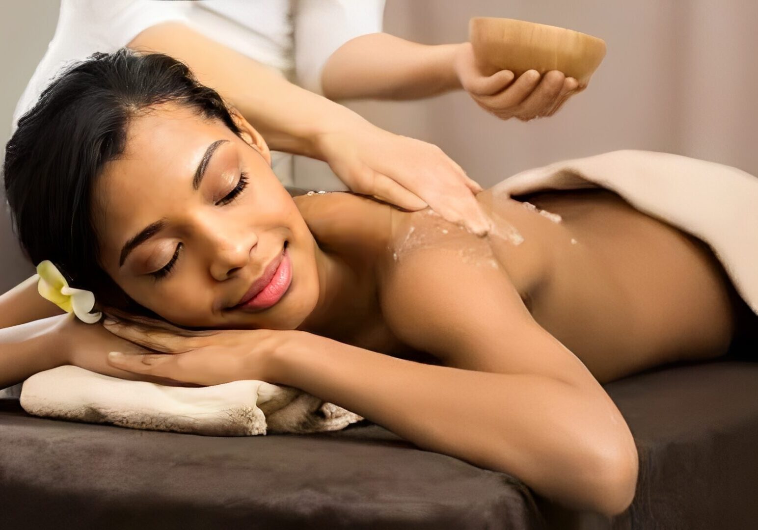 Woman enjoying a relaxing spa massage.